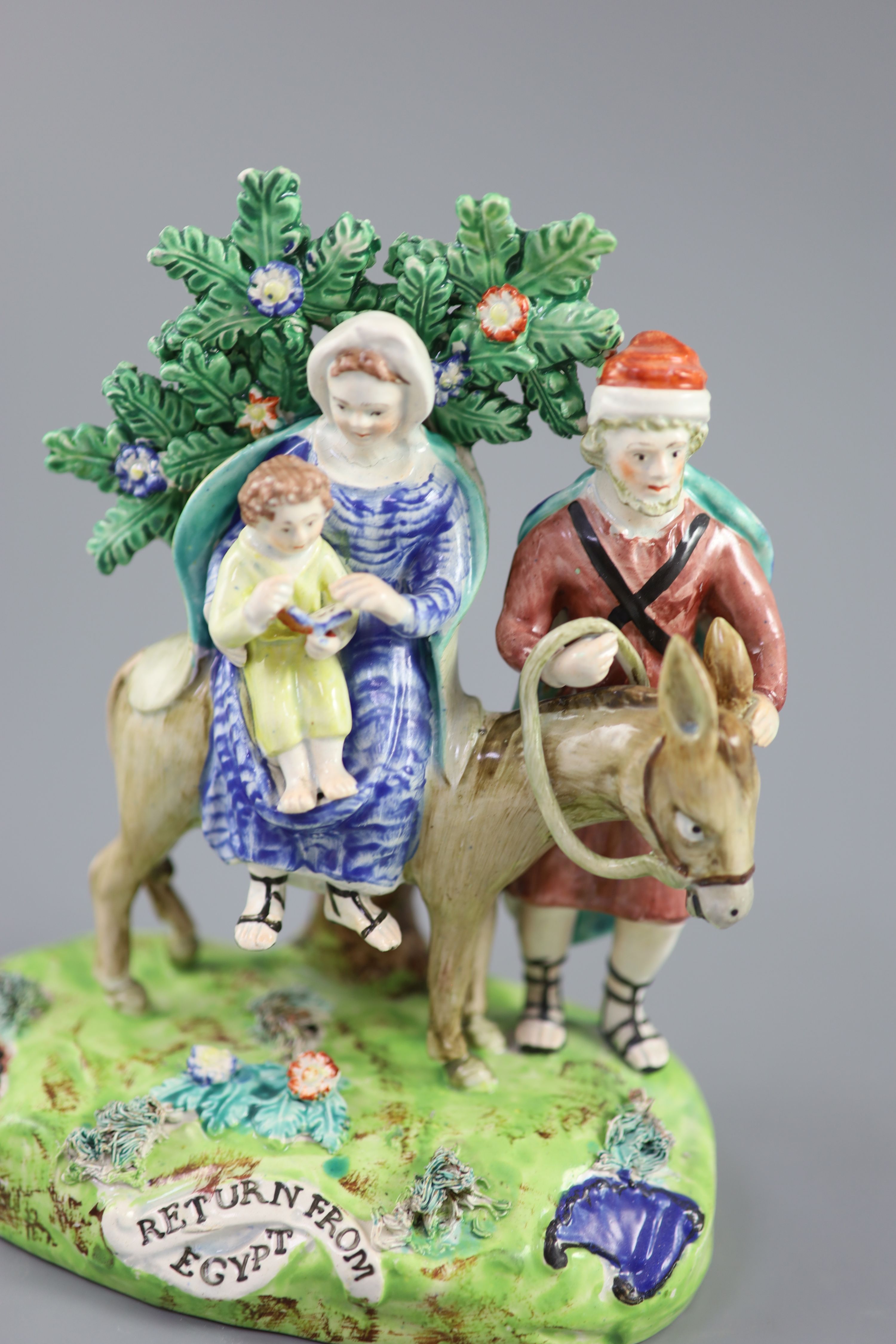 A John Walton of Burslem pearlware group Return from Egypt, 20cm high